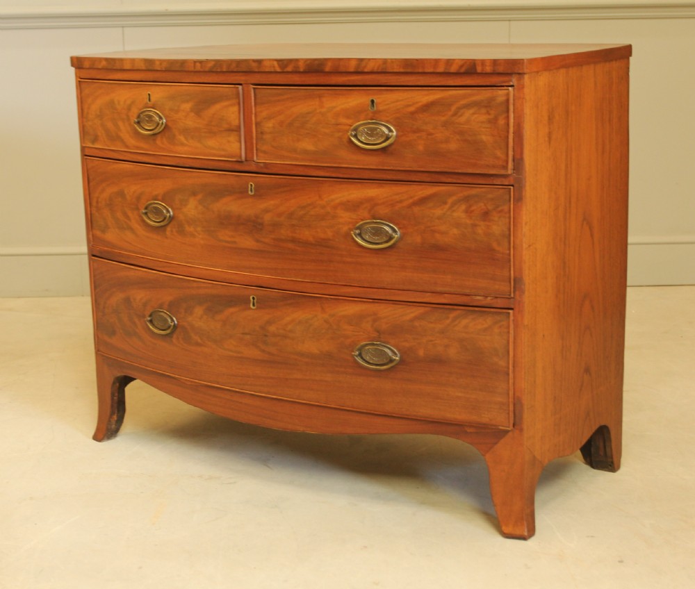 A REGENCY MAHOGANY BOW FRONTED CHEST OF DRAWERS. View XI
