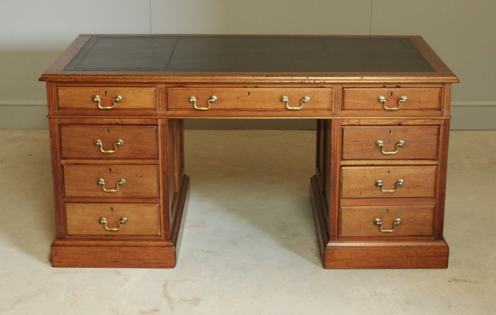 A LARGE EARLY 20TH MAHOAGANY WRITING DESK.  View II
