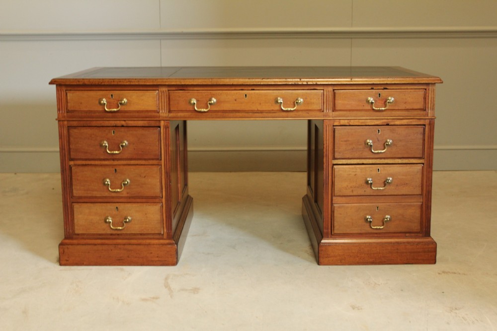 A LARGE EARLY 20TH MAHOAGANY WRITING DESK.  View III