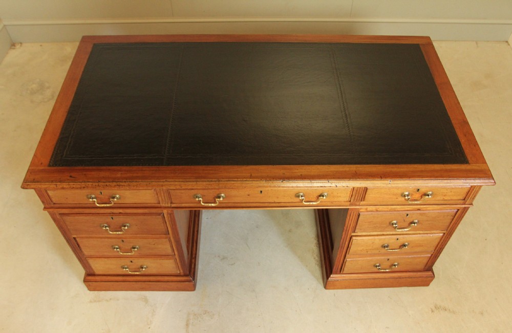 A LARGE EARLY 20TH MAHOAGANY WRITING DESK.  View IV