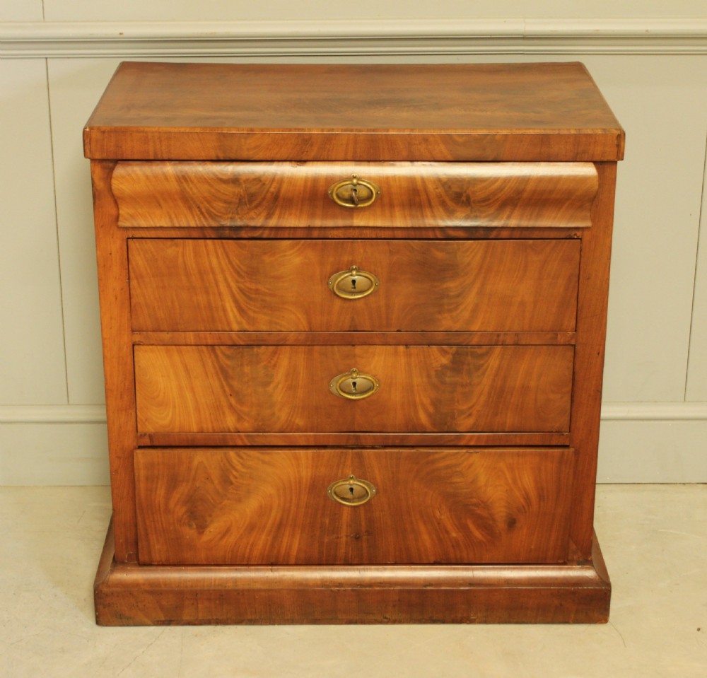A Curl mahogany 19th-century Swedish late Empire chest of drawers. View II