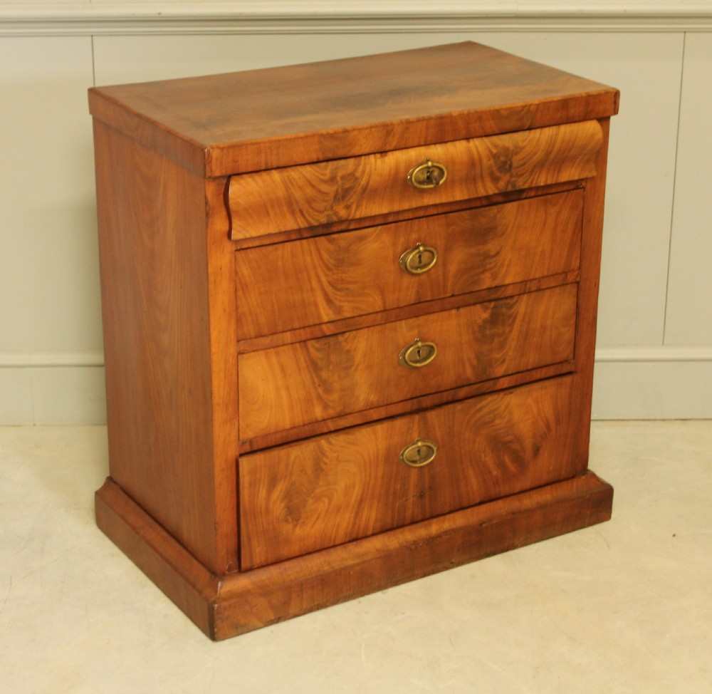 A Curl mahogany 19th-century Swedish late Empire chest of drawers. View V
