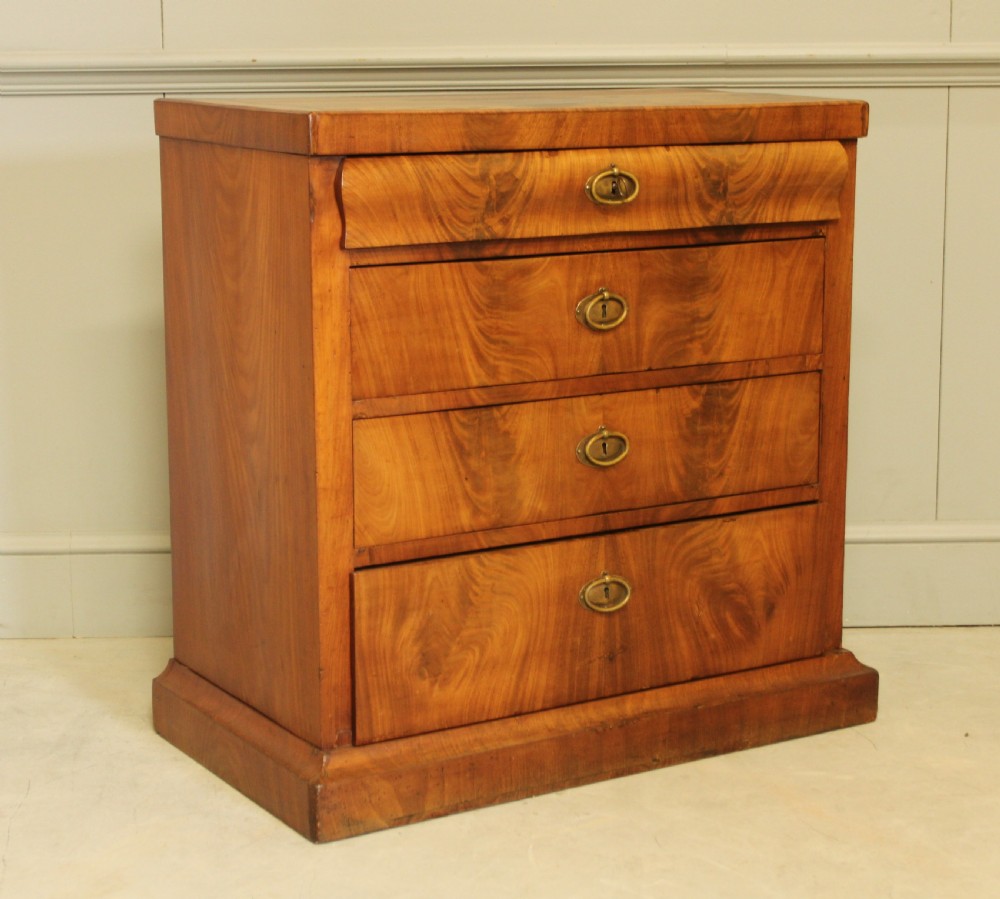 A Curl mahogany 19th-century Swedish late Empire chest of drawers. View VI