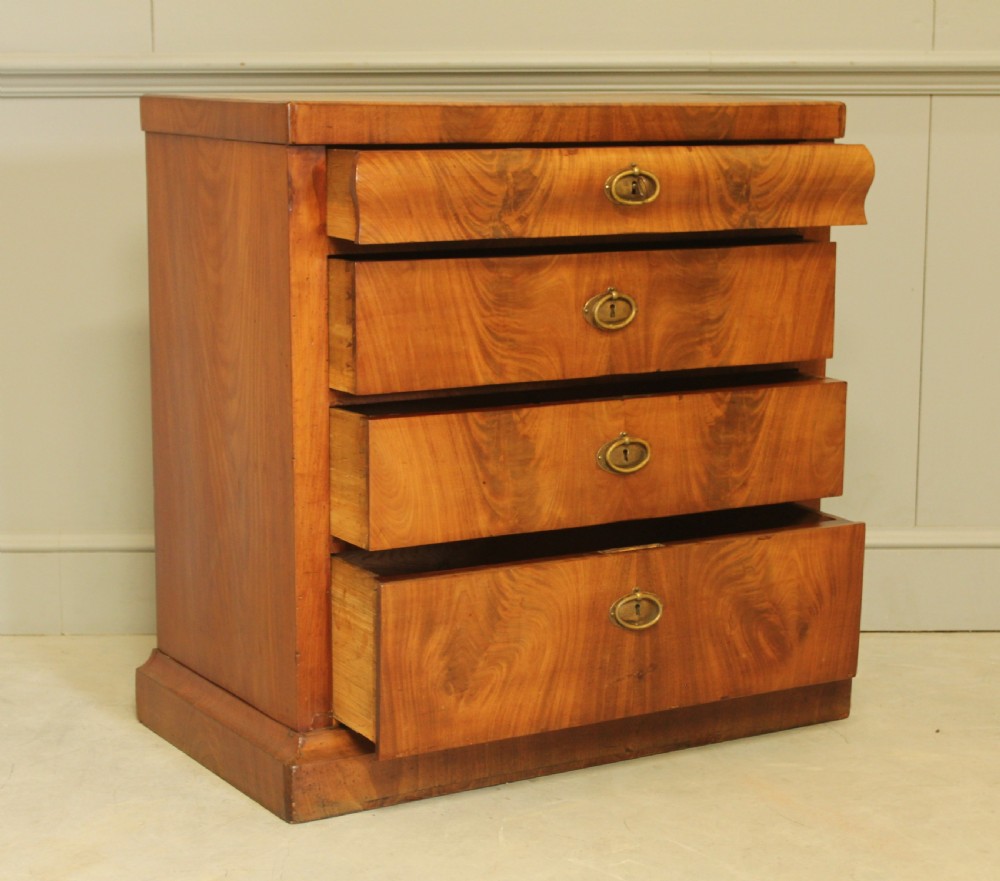 A Curl mahogany 19th-century Swedish late Empire chest of drawers. View VII