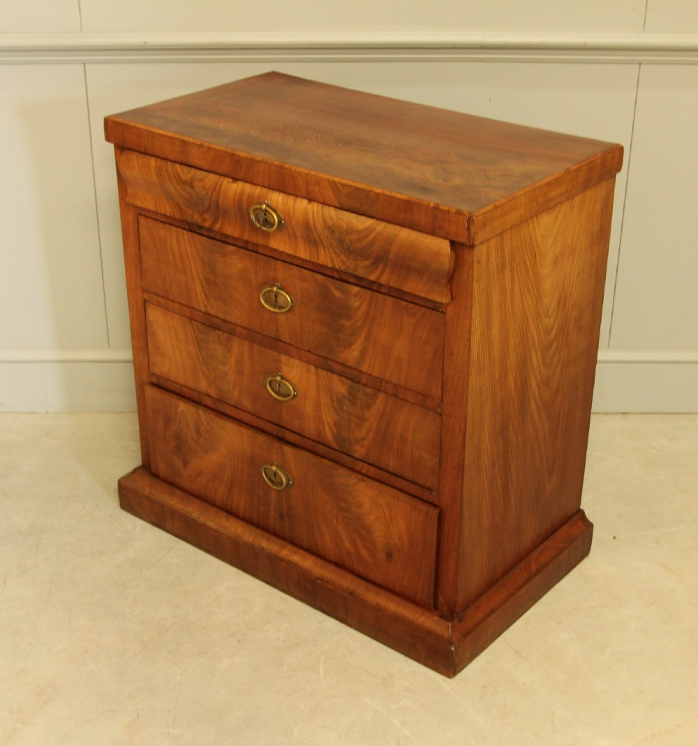 A Curl mahogany 19th-century Swedish late Empire chest of drawers. View IX