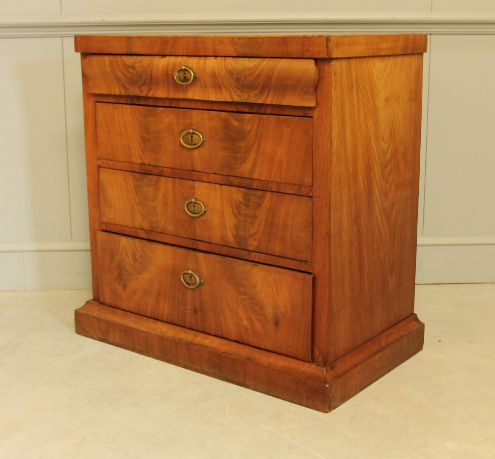A Curl mahogany 19th-century Swedish late Empire chest of drawers. View XI