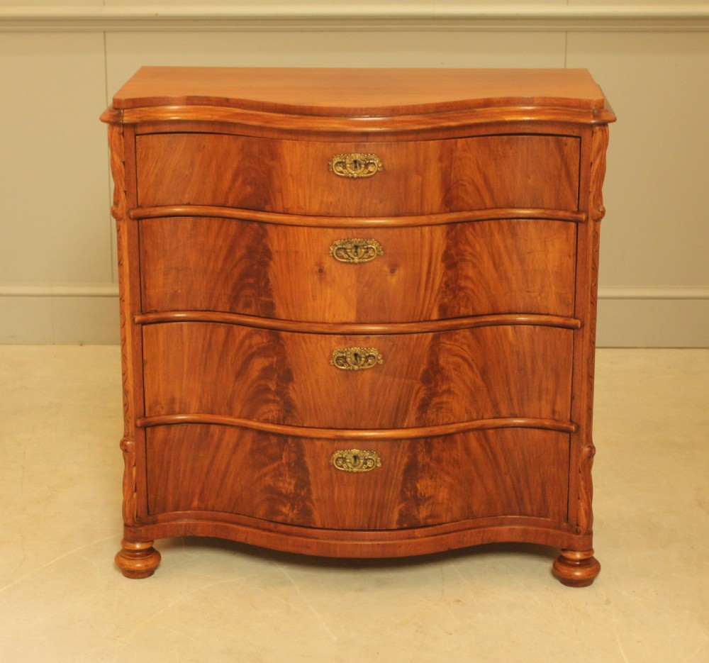 A 19th century Swedish serpentine chest of drawers. View II