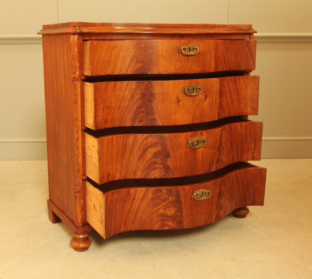 A 19th century Swedish serpentine chest of drawers. View VIII
