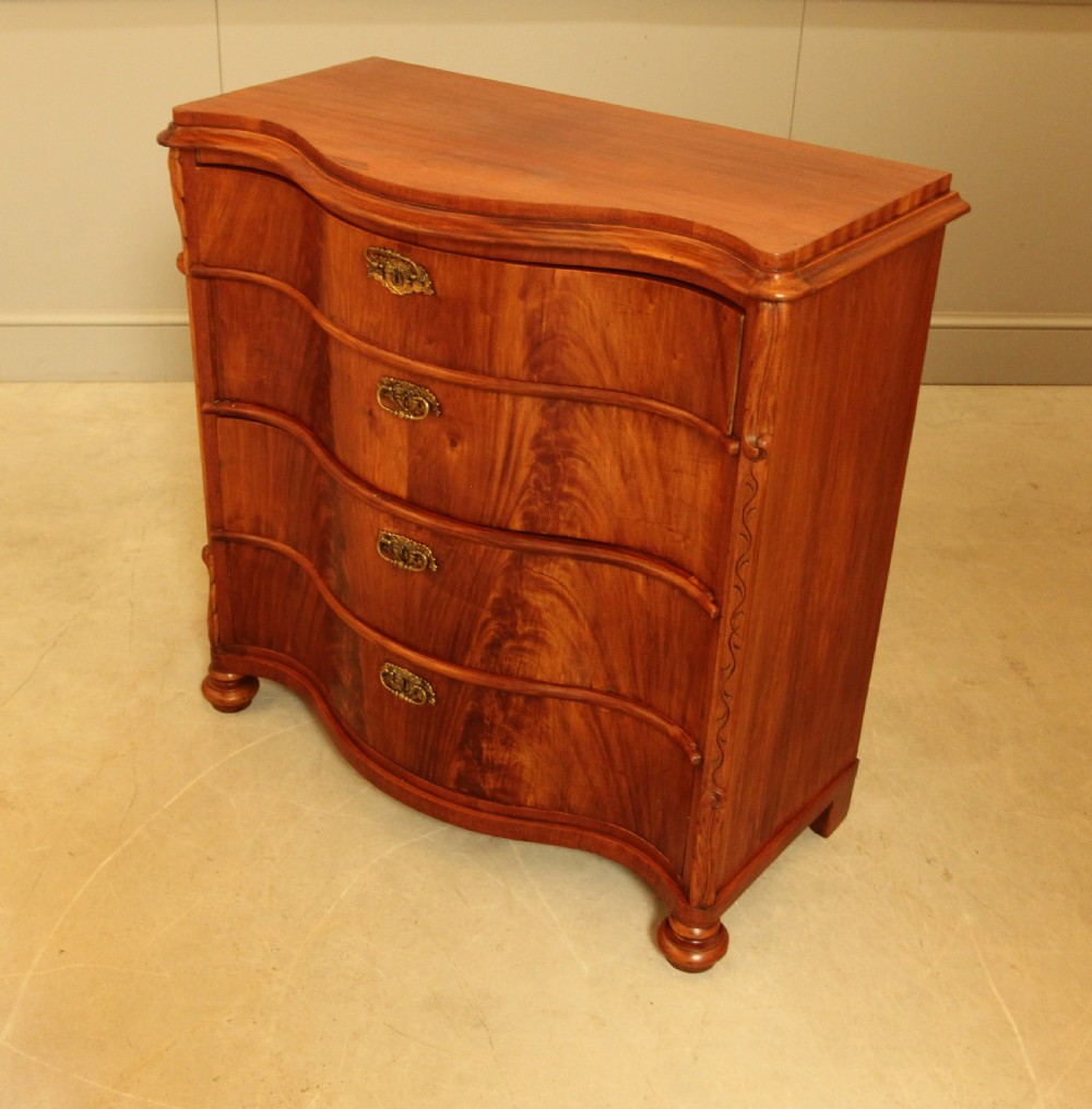 A 19th century Swedish serpentine chest of drawers. View X