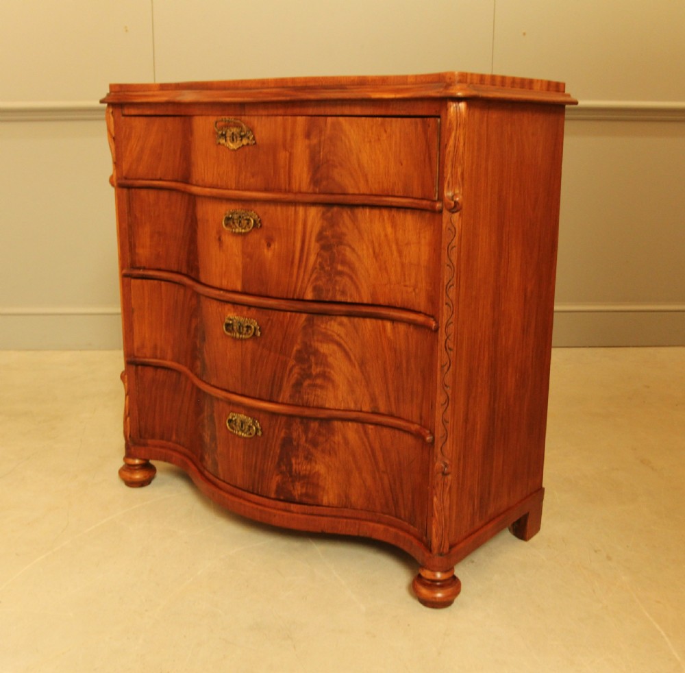 A 19th century Swedish serpentine chest of drawers. View XI