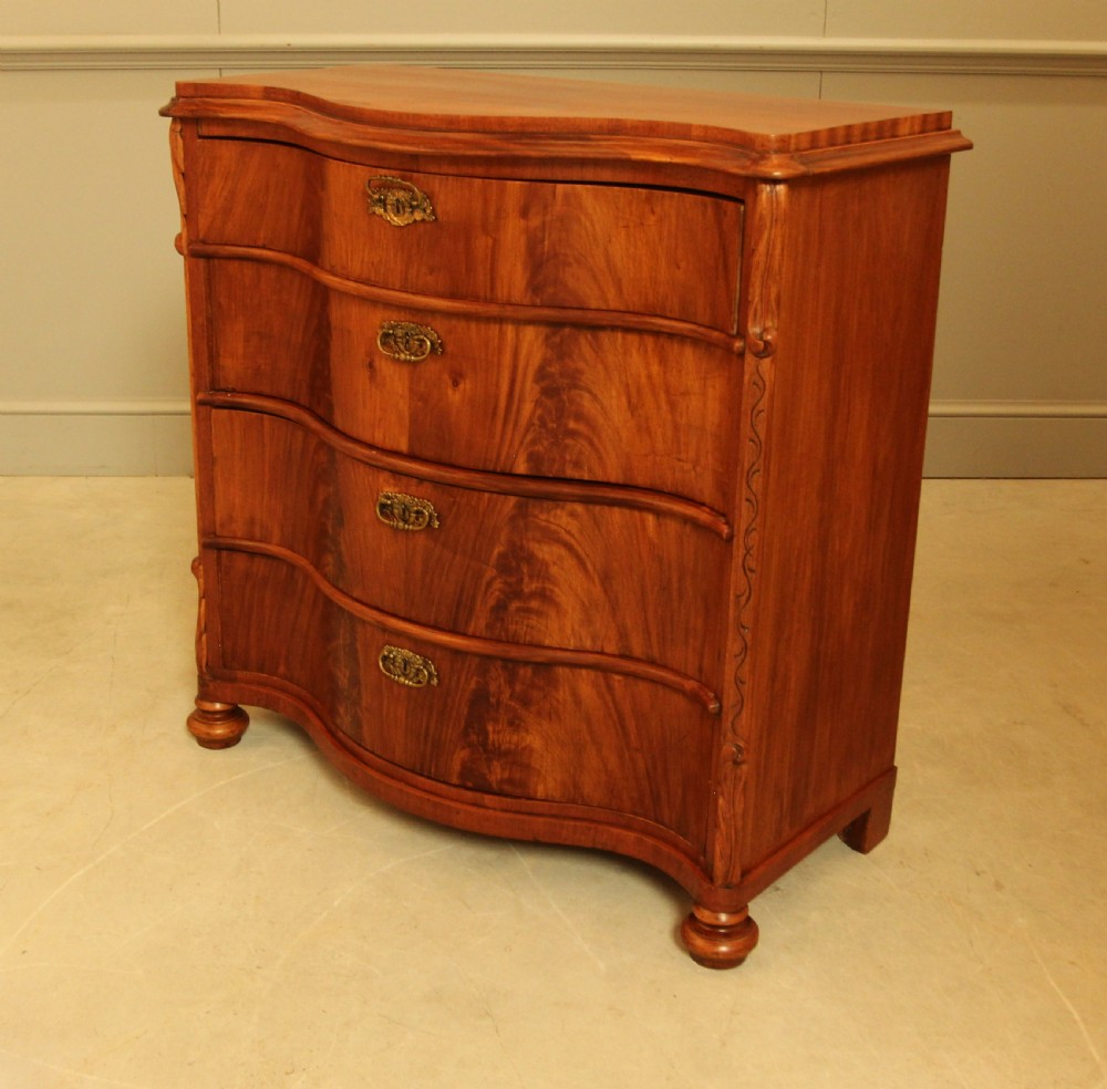 A 19th century Swedish serpentine chest of drawers. View XII
