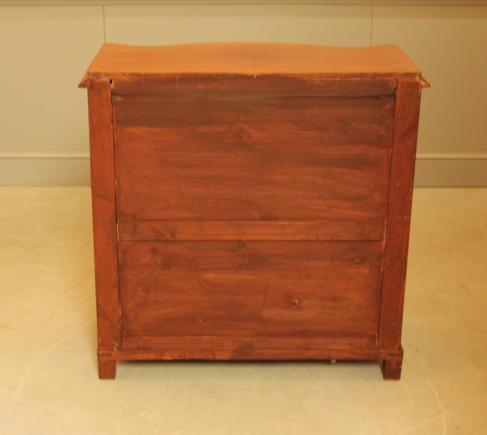 A 19th century Swedish serpentine chest of drawers. View XIII