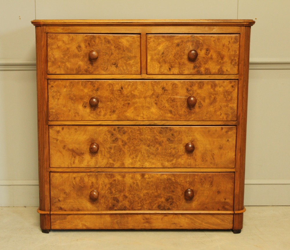A VICTORIAN BURR WALNUT CHEST OF DRAWERS
