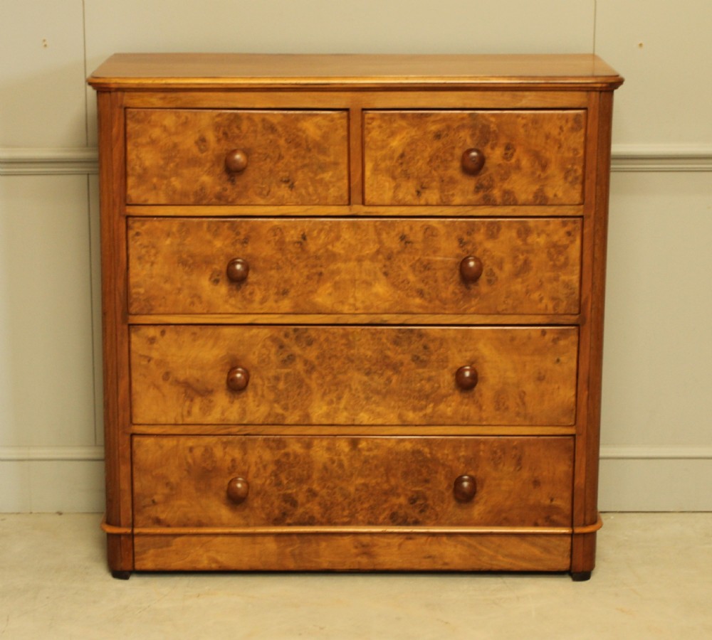 A VICTORIAN BURR WALNUT CHEST OF DRAWERS View II