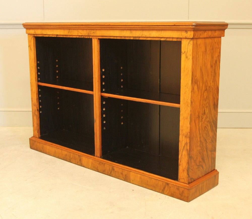 A VICTORIAN WALNUT OPEN BOOKCASE