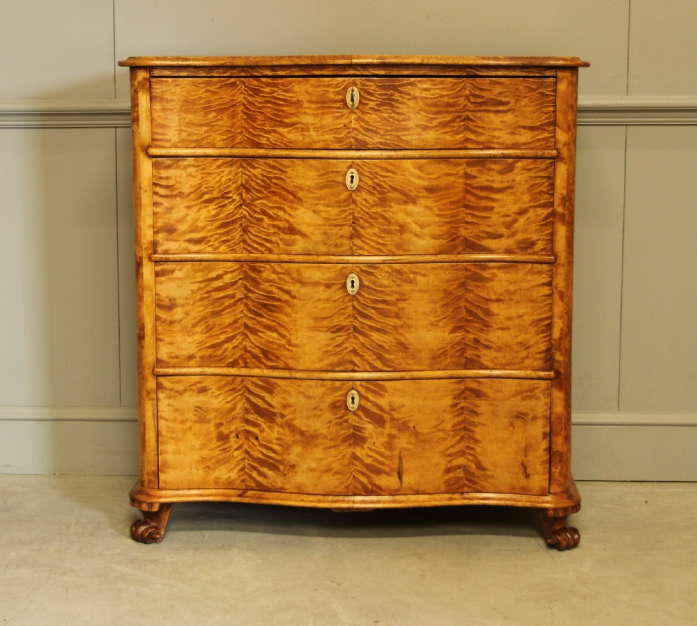 A 19th century Swedish serpentine chest of drawers.  View III