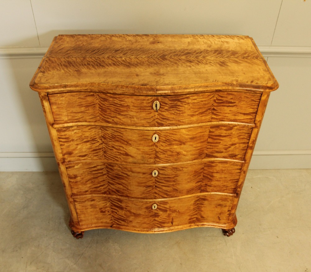 A 19th century Swedish serpentine chest of drawers.  View IV