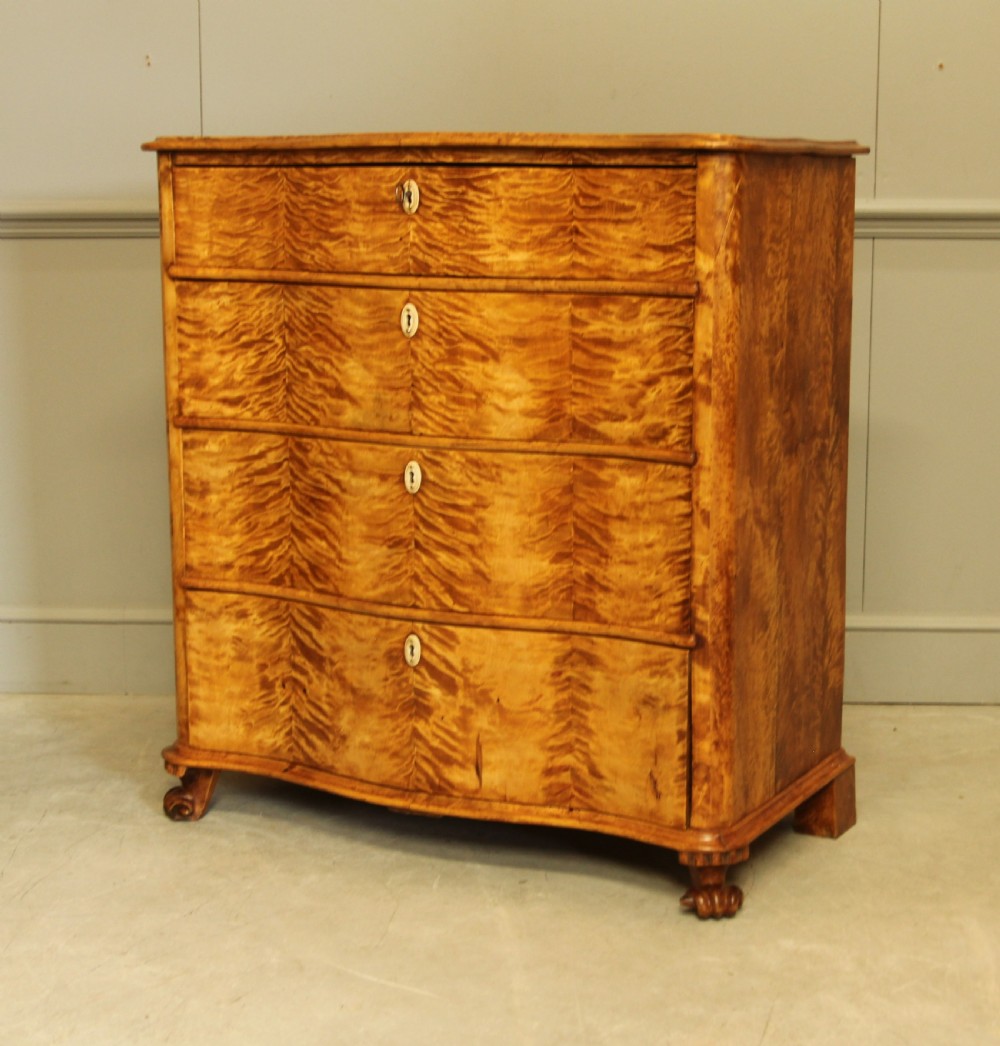 A 19th century Swedish serpentine chest of drawers.  View VII