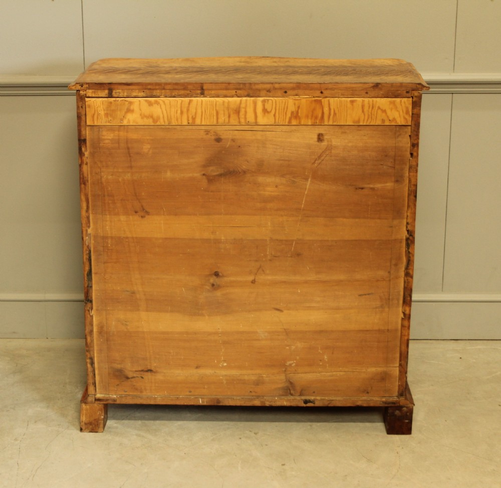 A 19th century Swedish serpentine chest of drawers.  View XI