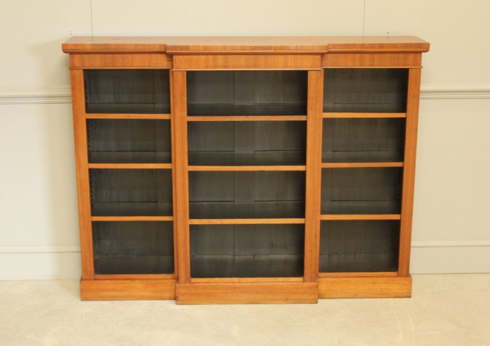 A low Victorian mahogany breakfront open bookcase featuring three sections with adjustable shelving on a solid plinth base. View II