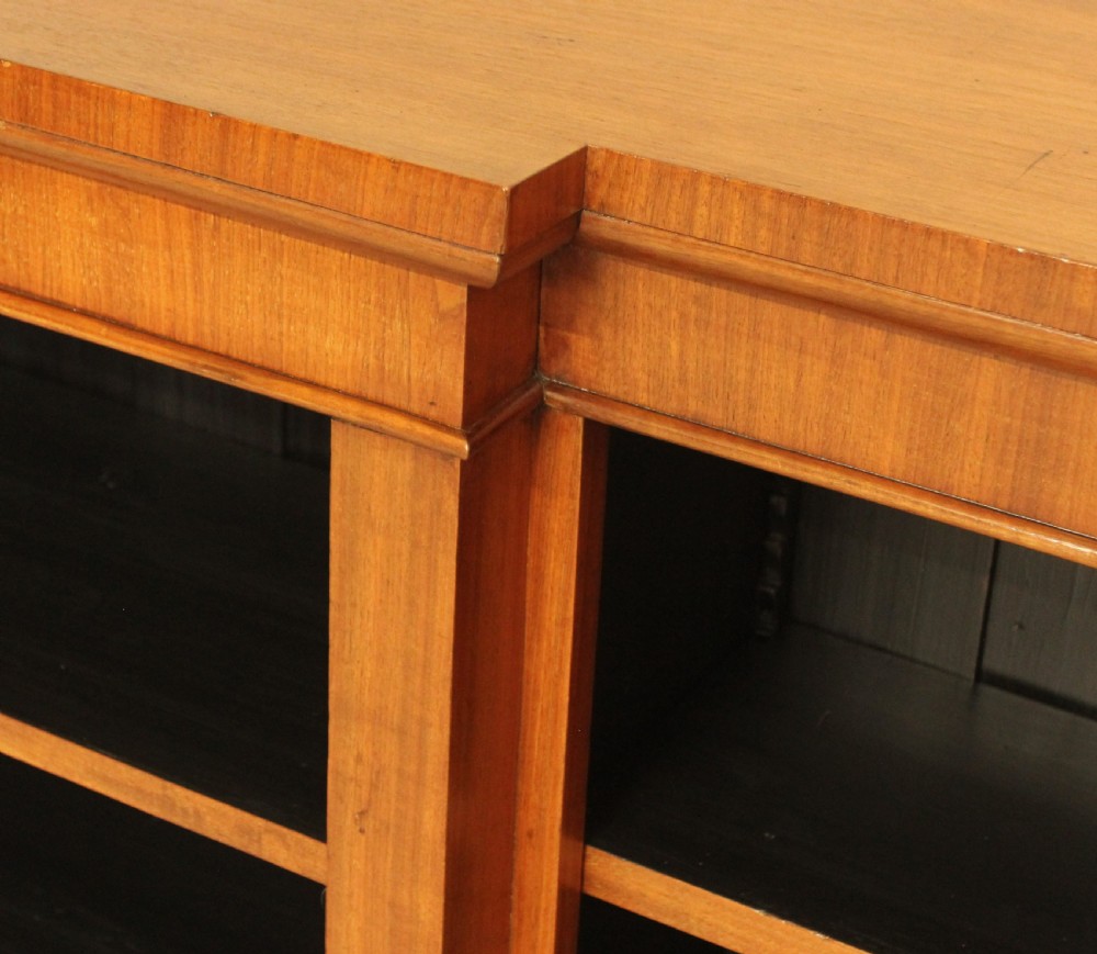 A low Victorian mahogany breakfront open bookcase featuring three sections with adjustable shelving on a solid plinth base. View V