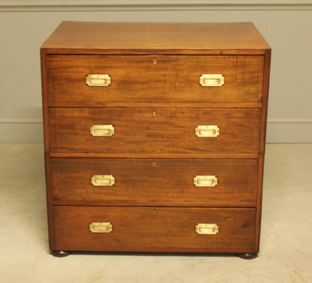 An early twentieth-century mahogany campaign chest featuring four full-width drawers with flush recessed brass handles. View II