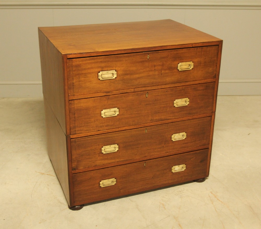 An early twentieth-century mahogany campaign chest featuring four full-width drawers with flush recessed brass handles. View IV