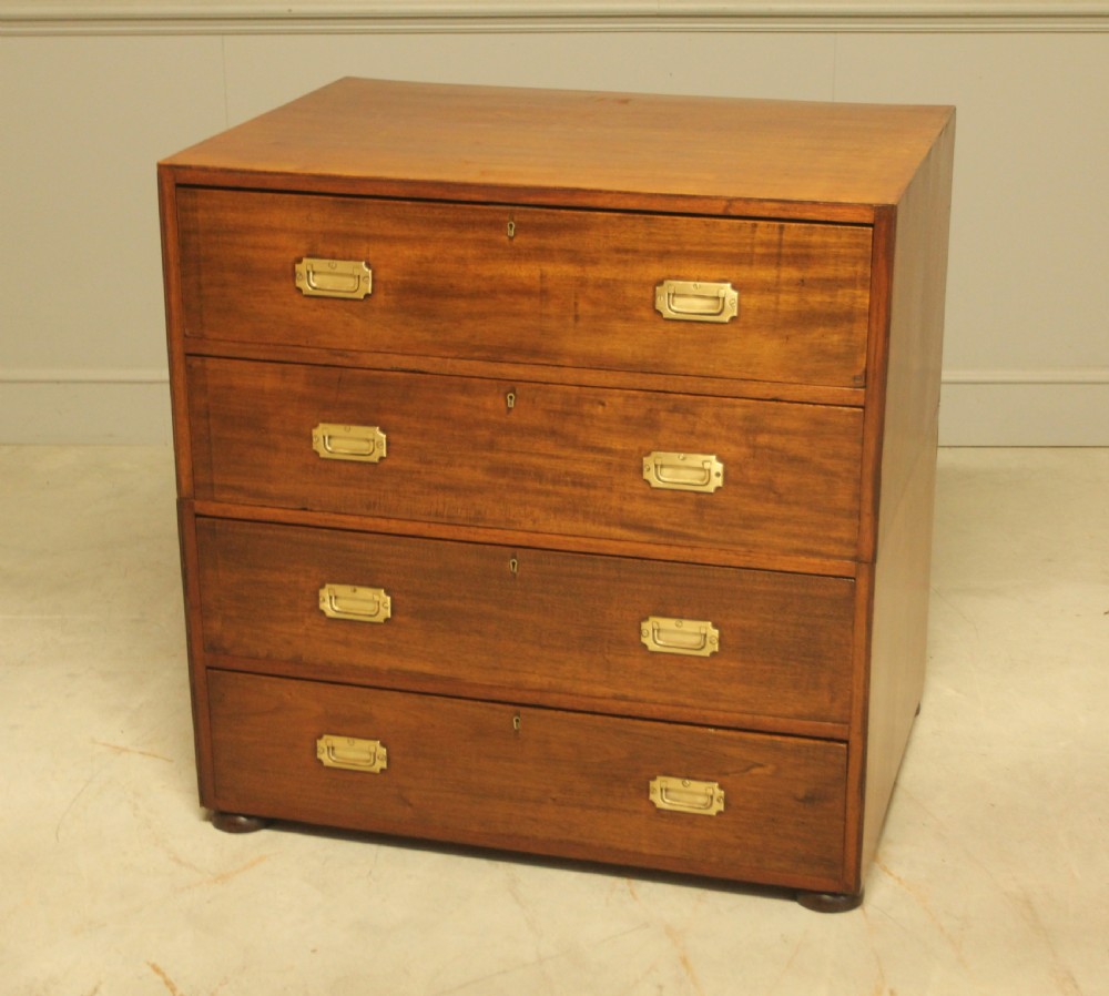 An early twentieth-century mahogany campaign chest featuring four full-width drawers with flush recessed brass handles. View VI
