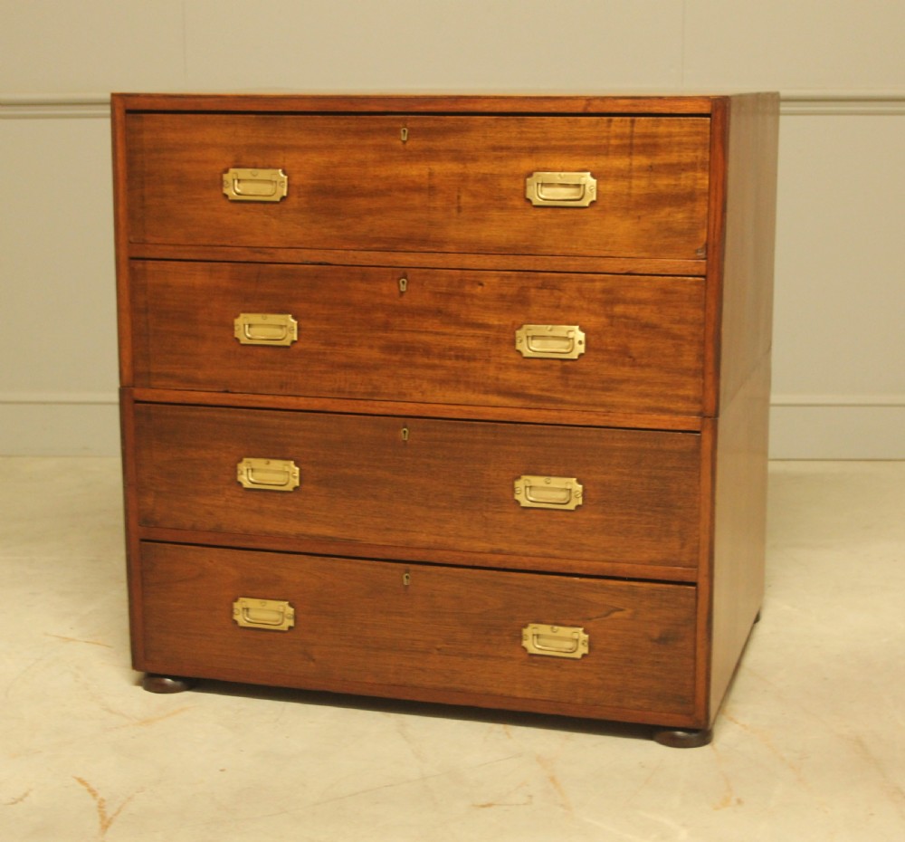 An early twentieth-century mahogany campaign chest featuring four full-width drawers with flush recessed brass handles. View VII