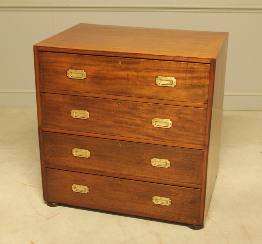An early twentieth-century mahogany campaign chest featuring four full-width drawers with flush recessed brass handles. View VIII