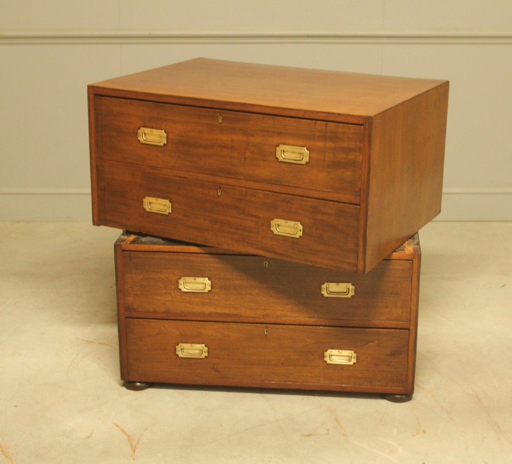 An early twentieth-century mahogany campaign chest featuring four full-width drawers with flush recessed brass handles. View IX