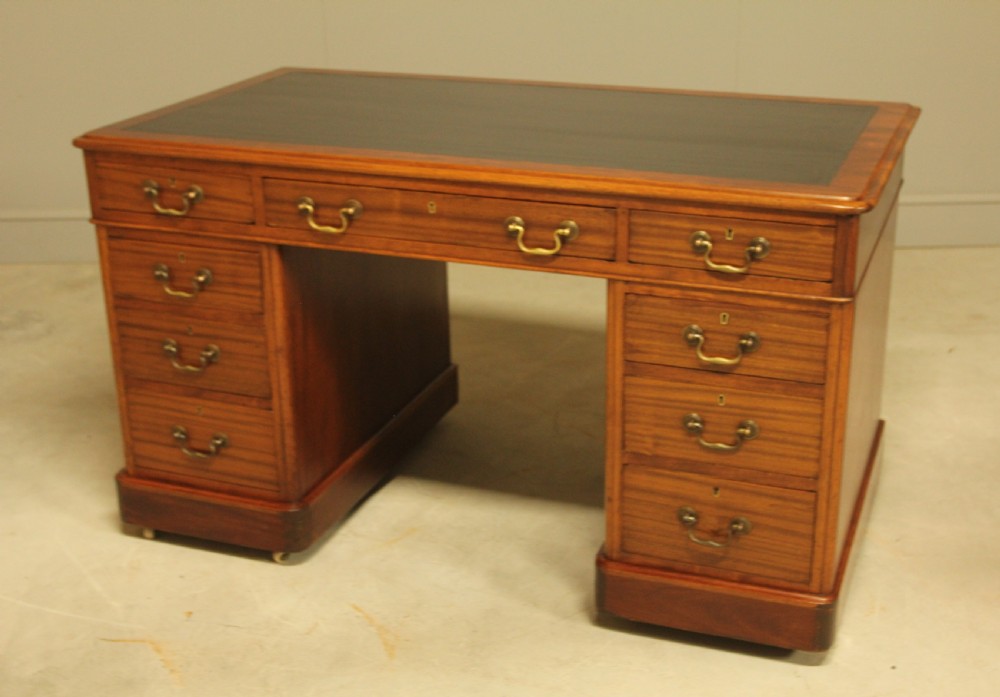 An early 20th-century mahogany twin-pedestal writing desk View VIII