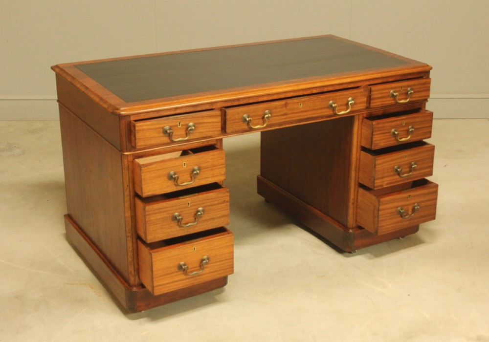 An early 20th-century mahogany twin-pedestal writing desk View IX