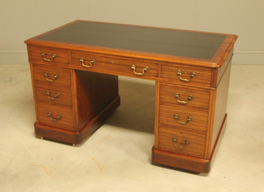 An early 20th-century mahogany twin-pedestal writing desk View X