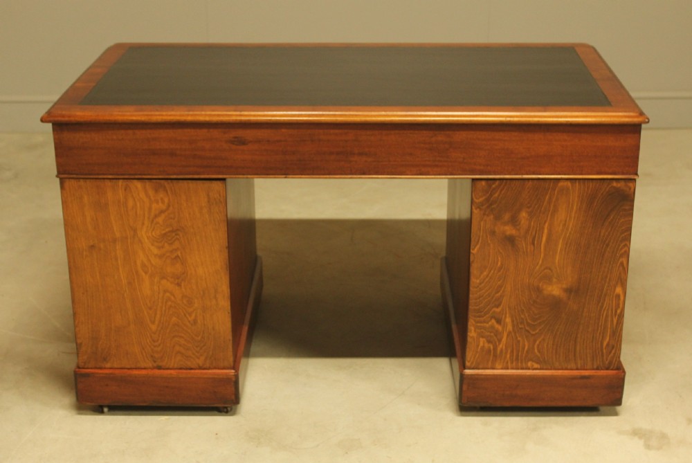 An early 20th-century mahogany twin-pedestal writing desk View XII