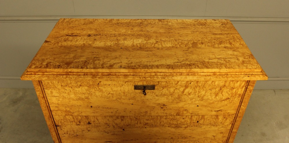 A 19th-century Swedish Masur birch secretaire desk featuring a fall-front top compartment above three wide drawers with brass handles. View VIII
