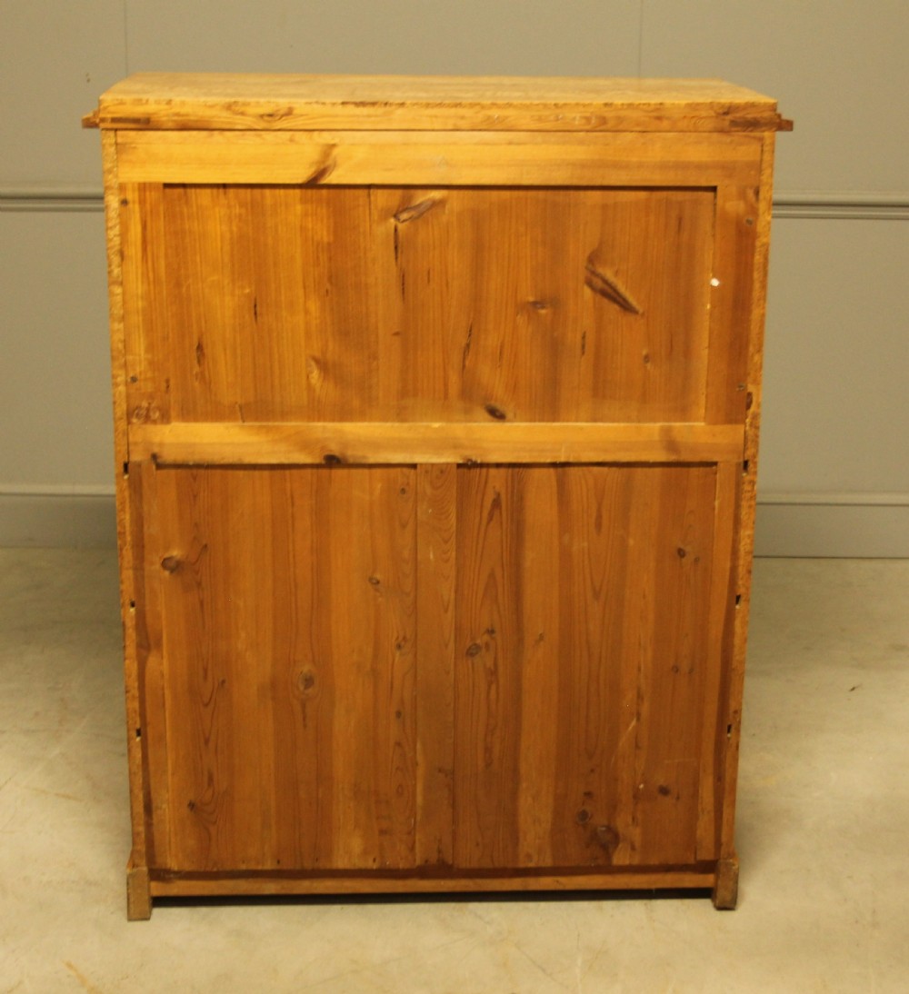 A 19th-century Swedish Masur birch secretaire desk featuring a fall-front top compartment above three wide drawers with brass handles. View XIV