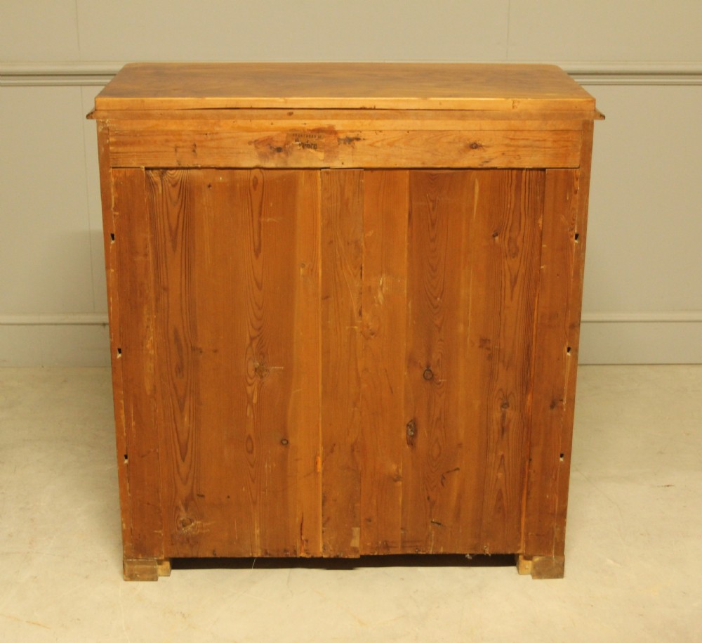 A late nineteenth-century Swedish burr walnut chest of drawers with four full-width drawers and brass handles. View X
