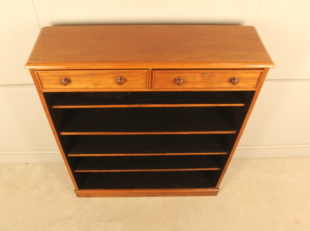 A tall 19th-century mahogany open bookcase featuring two upper frieze drawers with turned wooden knobs above five open shelves supported by a solid plinth base. View VIII