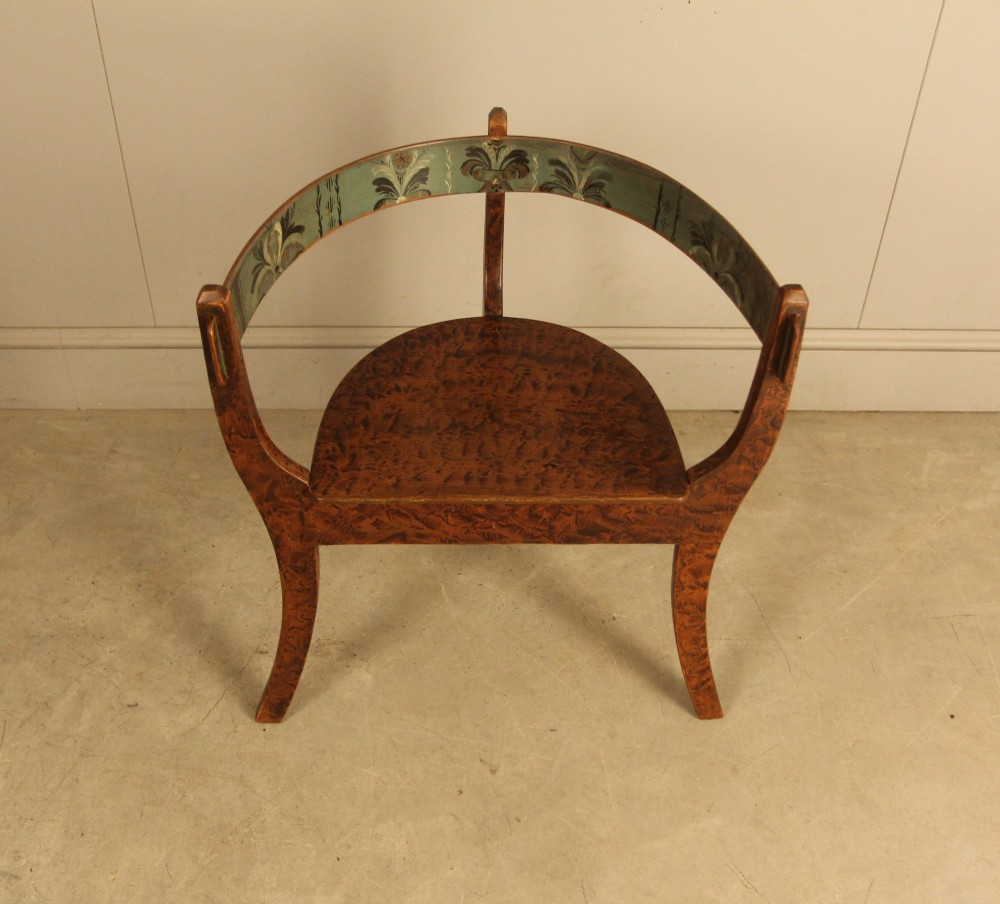An early 20th-century Norwegian wooden chair with a curved backrest decorated with hand-painted green floral motifs and a faux-grained finish. View III