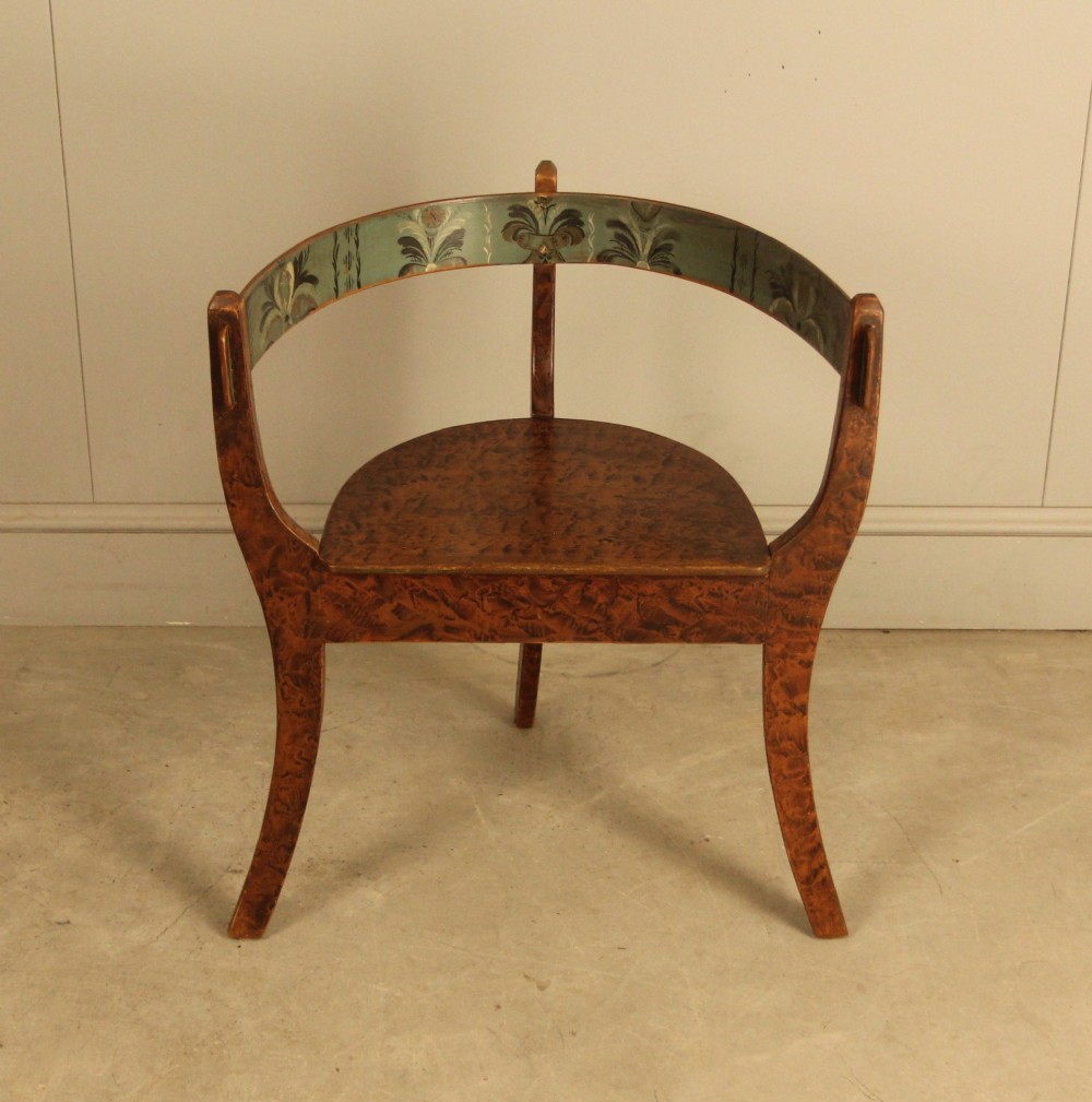 An early 20th-century Norwegian wooden chair with a curved backrest decorated with hand-painted green floral motifs and a faux-grained finish. View IV