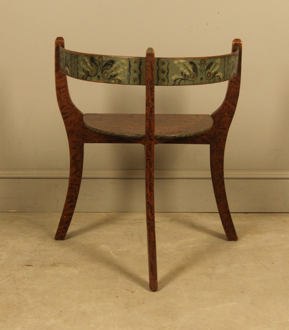 An early 20th-century Norwegian wooden chair with a curved backrest decorated with hand-painted green floral motifs and a faux-grained finish. View VII
