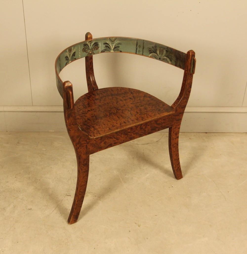 An early 20th-century Norwegian wooden chair with a curved backrest decorated with hand-painted green floral motifs and a faux-grained finish. View IX