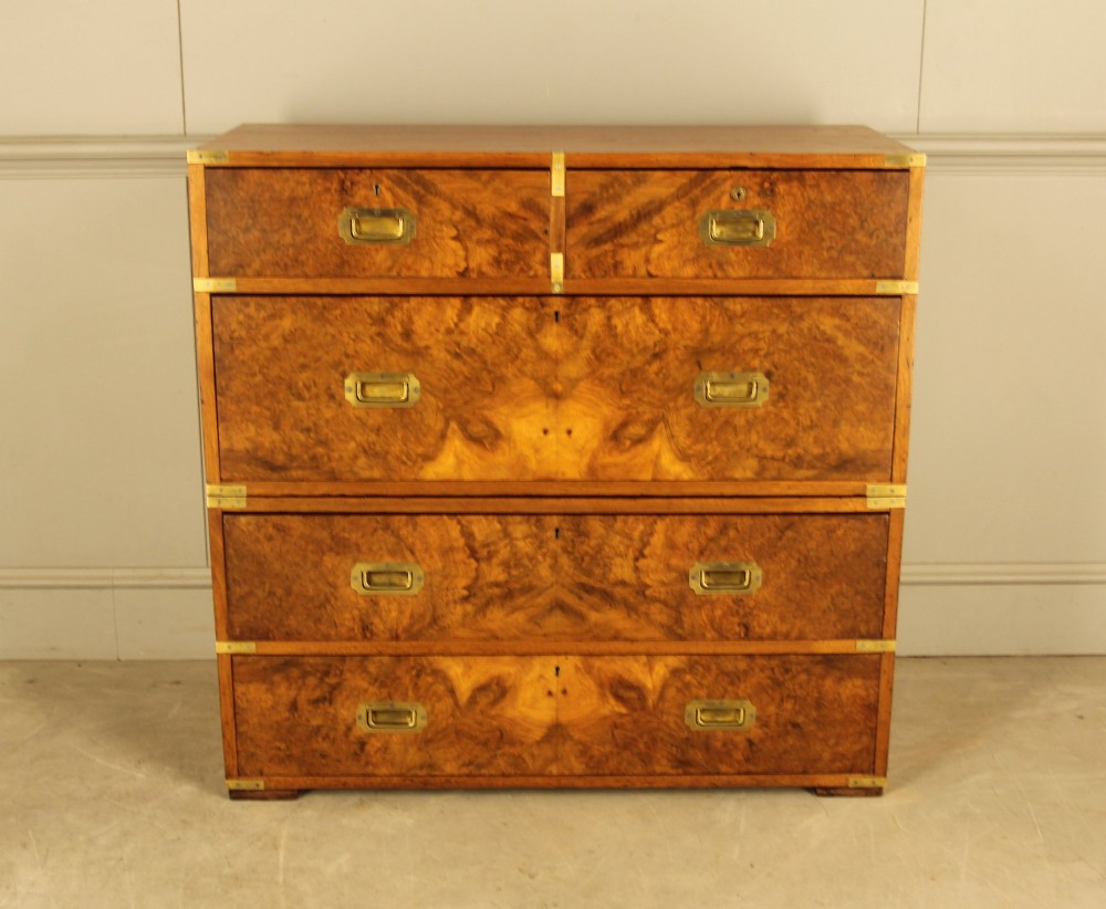 A Victorian burr walnut campaign chest of drawers featuring flush brass corner mounts, recessed drawer pulls, and side carrying handles. View II