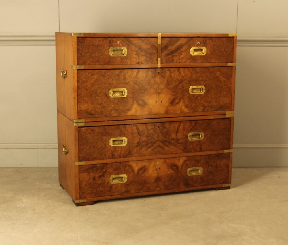 A Victorian burr walnut campaign chest of drawers featuring flush brass corner mounts, recessed drawer pulls, and side carrying handles. View III