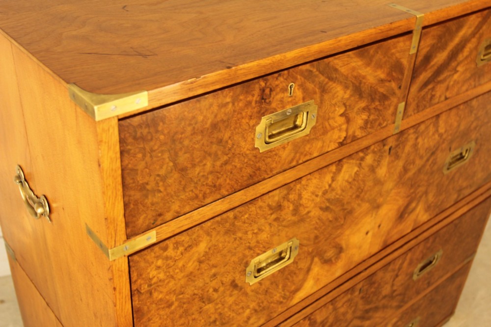 A Victorian burr walnut campaign chest of drawers featuring flush brass corner mounts, recessed drawer pulls, and side carrying handles. View VIII