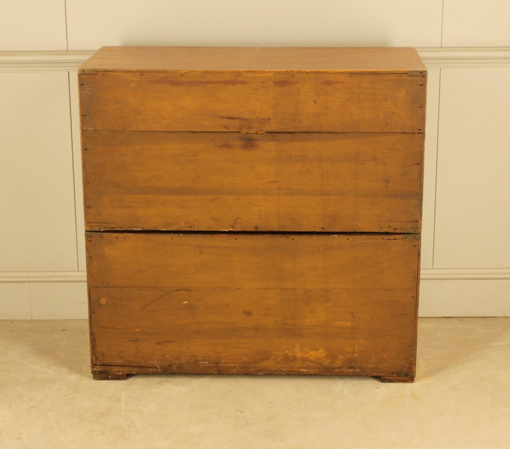 A Victorian burr walnut campaign chest of drawers featuring flush brass corner mounts, recessed drawer pulls, and side carrying handles. View XI
