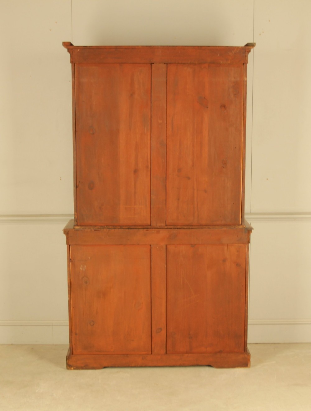 A 19th-century Victorian walnut bookcase featuring an open two-shelf upper section above a two-door lower cupboard with gilt metal mounts and inlaid detailing. View IX