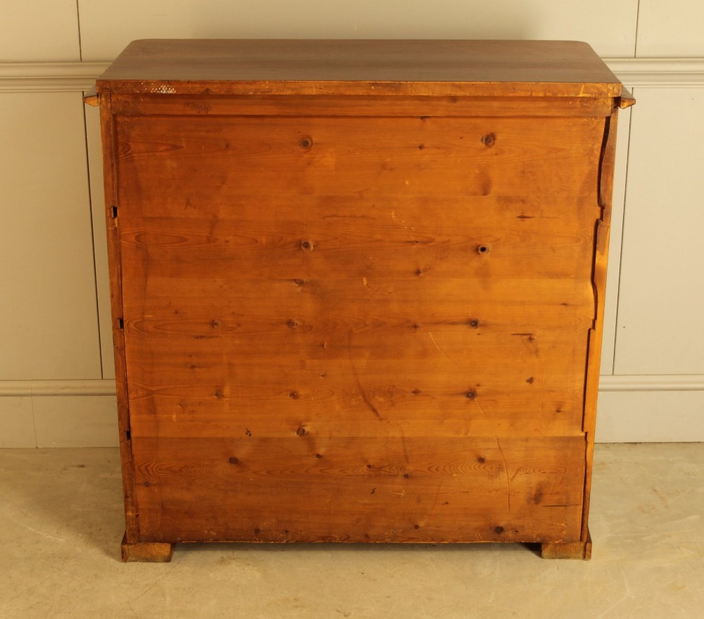 A 19th-century Swedish chest of drawers in warm curl mahogany featuring book-matched veneer, brass escutcheons, and a clean rectangular silhouette. View X