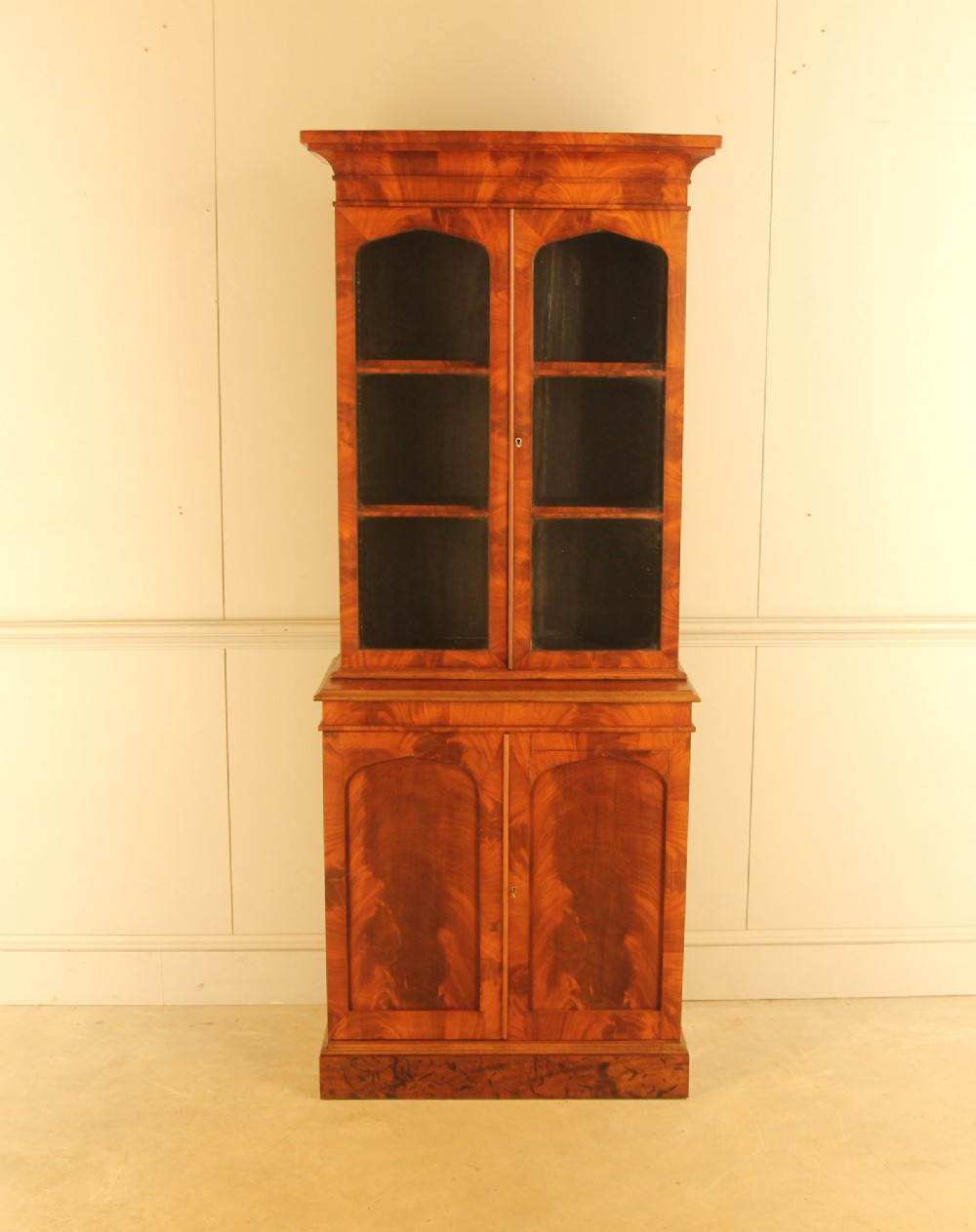 A 19th‑century mahogany glazed display bookcase